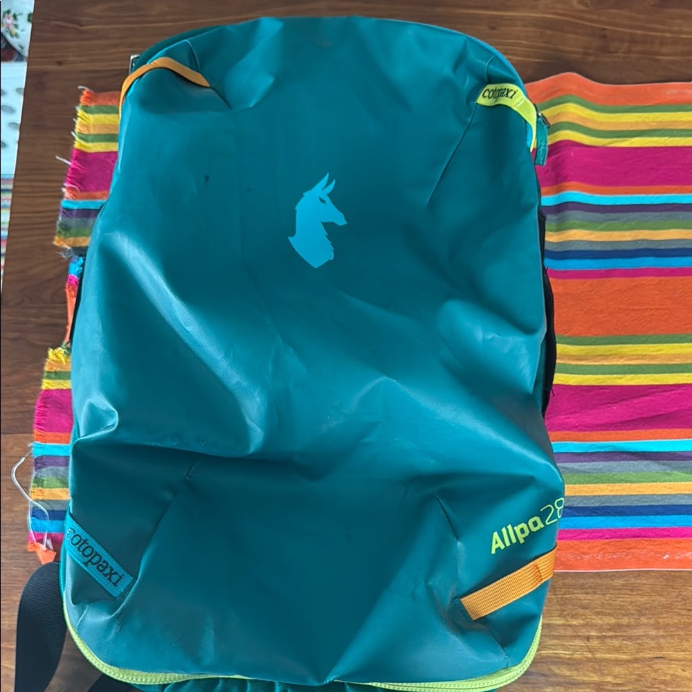 Cotopaxi Teal Backpack with Yellow Accents
